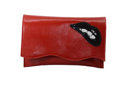 Biting Lips on Red Leather Clutch